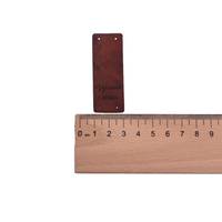 Obrázok ku produktu NÁŠIVKA Vyrobené s láskou hnedá tmavá 6x2cm dole