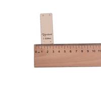 Obrázok ku produktu NÁŠIVKA Vyrobené s láskou béžová 6x2cm dole